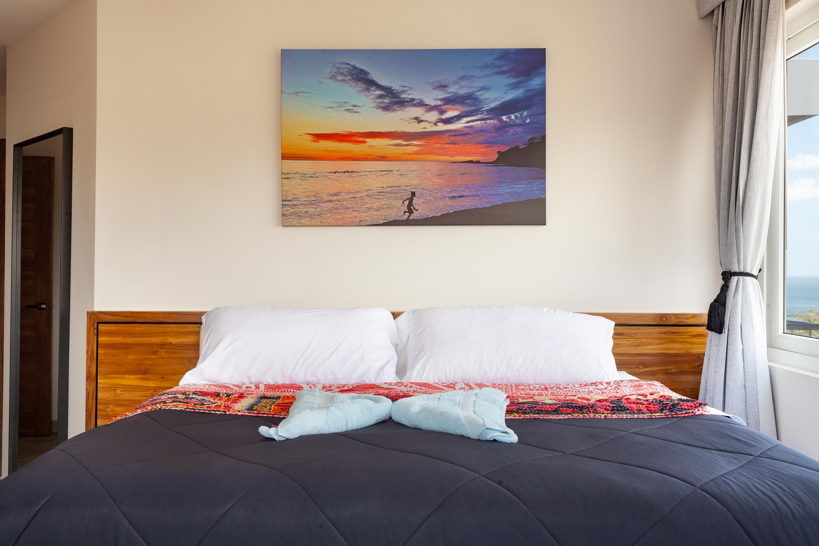 Cozy Bedroom with Ocean Art